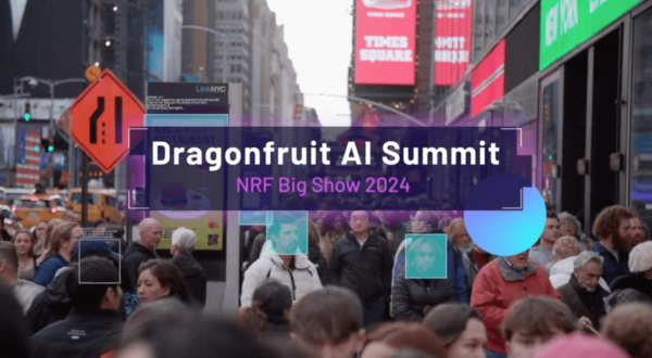 A bustling crowd on a city street with "Dragonfruit AI Summit NRF Big Show 2024" text overlay and an adjacent construction sign.